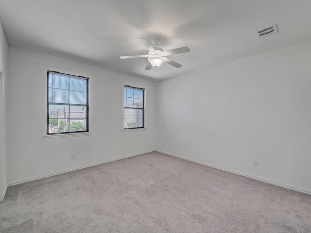 240 Harper St, Irving, TX 75063 - empty room with carpet, ceiling fan, and baseboards