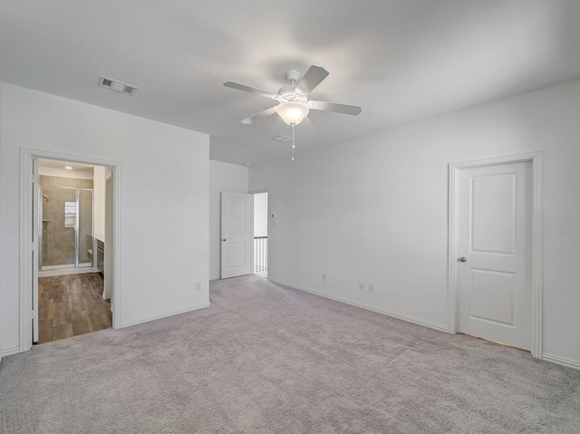 240 Harper St, Irving, TX 75063 - unfurnished bedroom featuring carpet flooring, baseboards, ensuite bathroom, and ceiling fan