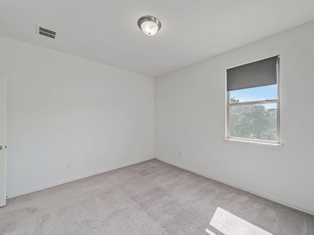 240 Harper St, Irving, TX 75063 - empty room with carpet floors and baseboards
