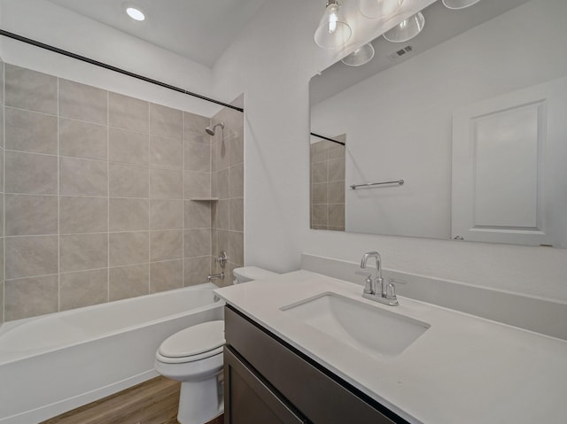 240 Harper St, Irving, TX 75063 - full bath with toilet, wood finished floors, vanity, and shower / bathtub combination