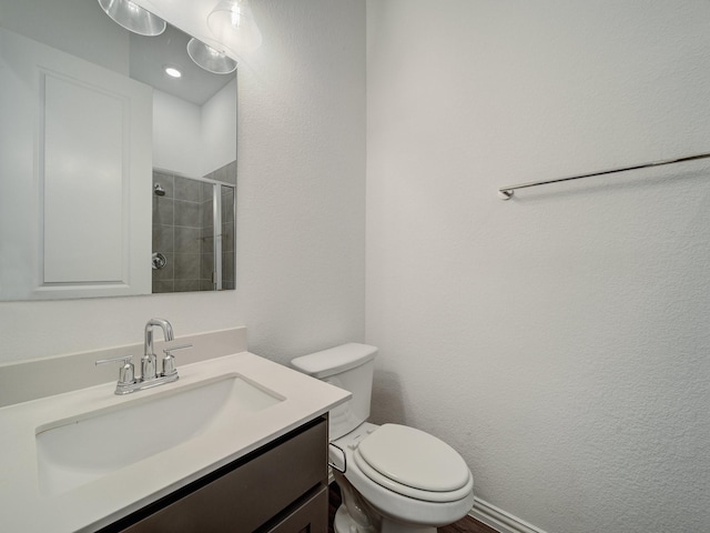 240 Harper St, Irving, TX 75063 - bathroom with a tile shower, toilet, and vanity