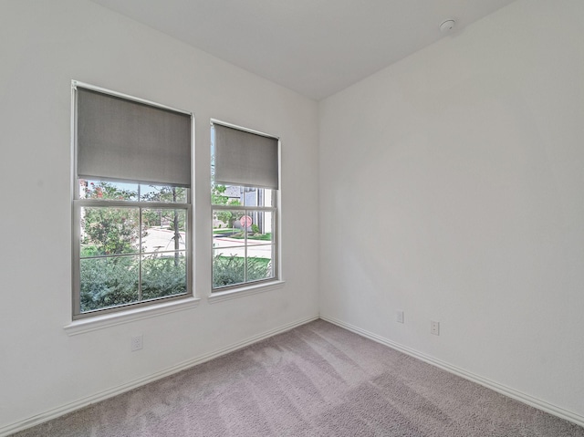 240 Harper St, Irving, TX 75063 - spare room featuring carpet flooring, baseboards, and a smoke detector