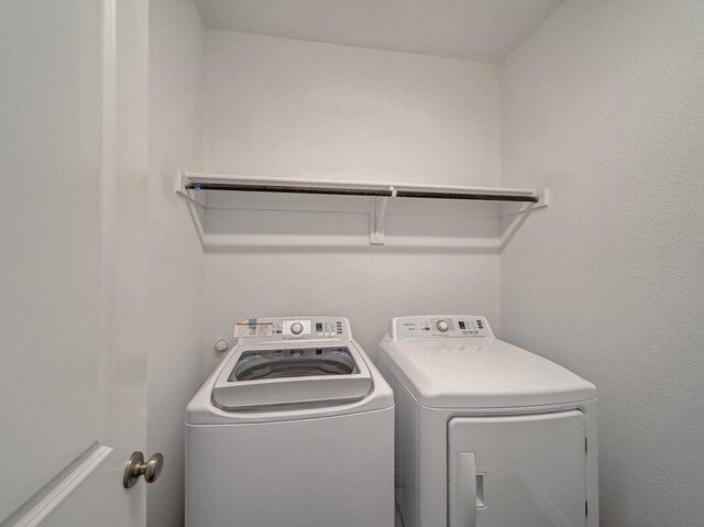 240 Harper St, Irving, TX 75063 - laundry room with washer and clothes dryer
