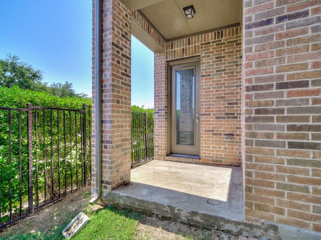240 Harper St, Irving, TX 75063 - property entrance featuring brick siding and fence