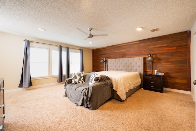 6318 White Oaks Ln, Frisco, TX 75035 - bedroom featuring wood walls, light colored carpet, baseboards, a textured ceiling, and a ceiling fan