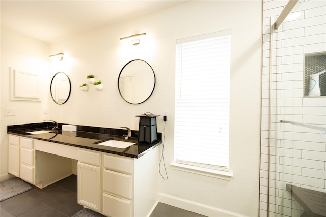 6318 White Oaks Ln, Frisco, TX 75035 - bathroom featuring baseboards, double vanity, and tile patterned flooring