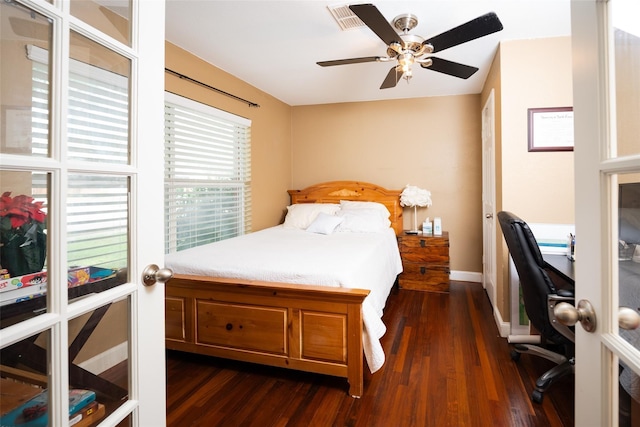 6318 White Oaks Ln, Frisco, TX 75035 - bedroom with dark wood finished floors, an office area, baseboards, and ceiling fan