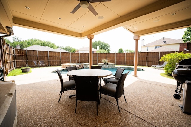6318 White Oaks Ln, Frisco, TX 75035 - view of patio featuring a fenced backyard, outdoor dining area, ceiling fan, and a pool with connected hot tub