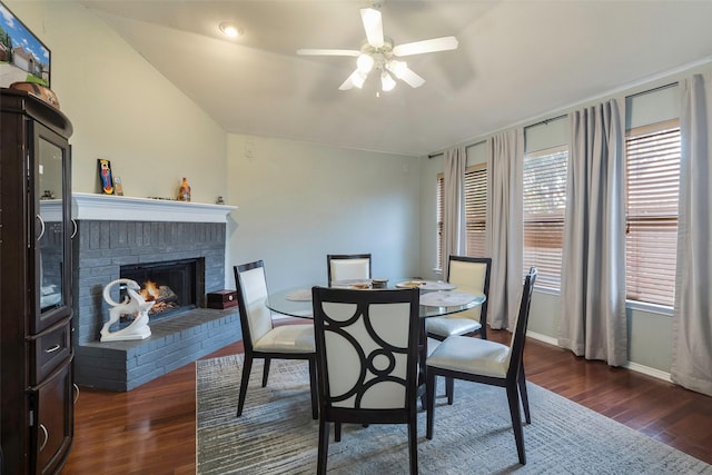 809 Fox Run Trl, Saginaw, TX 76179 - dining room featuring ceiling fan, dark wood-type flooring, a fireplace, and baseboards