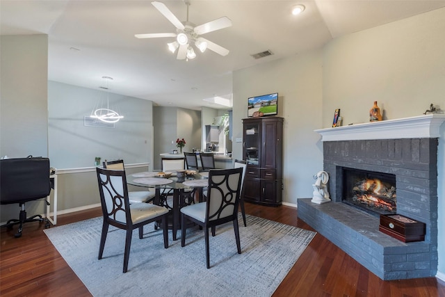 809 Fox Run Trl, Saginaw, TX 76179 - dining space with dark wood-type flooring, a brick fireplace, ceiling fan, and baseboards