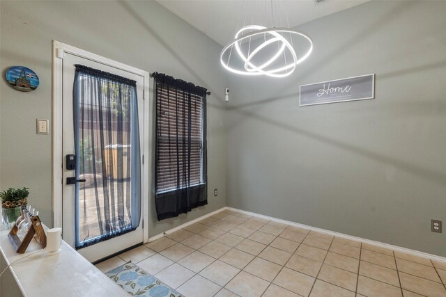 809 Fox Run Trl, Saginaw, TX 76179 - unfurnished dining area with a chandelier, tile patterned flooring, and baseboards