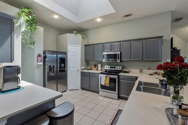 809 Fox Run Trl, Saginaw, TX 76179 - kitchen with appliances with stainless steel finishes, a sink, light countertops, light tile patterned flooring, and recessed lighting