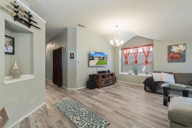 809 Fox Run Trl, Saginaw, TX 76179 - living room featuring a chandelier, light wood-type flooring, vaulted ceiling, and baseboards