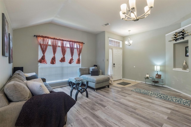 809 Fox Run Trl, Saginaw, TX 76179 - living area featuring a chandelier, light wood-type flooring, lofted ceiling, and baseboards