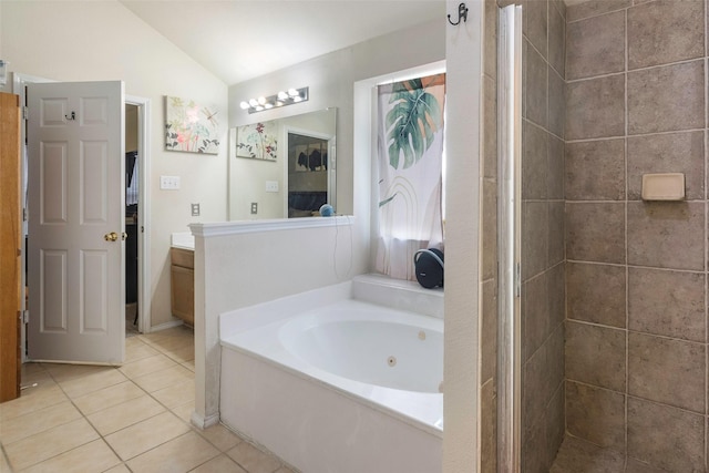 809 Fox Run Trl, Saginaw, TX 76179 - bathroom featuring vaulted ceiling, tile patterned floors, a tub with jets, vanity, and a tile shower