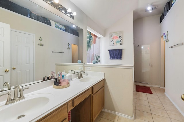809 Fox Run Trl, Saginaw, TX 76179 - full bath with tile patterned floors, a shower with shower door, double vanity, vaulted ceiling, and baseboards