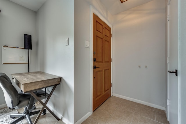 7640 W Greenway Blvd Unit 8L, Dallas, TX 75209 - foyer with baseboards and light tile patterned floors