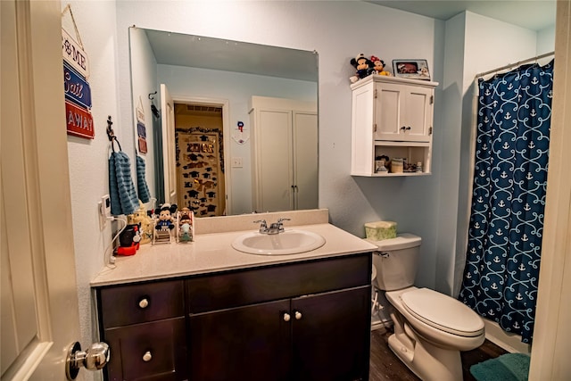 1141 Avalon Dr, Crandall, TX 75114 - bathroom with vanity, toilet, wood finished floors, and a shower with shower curtain