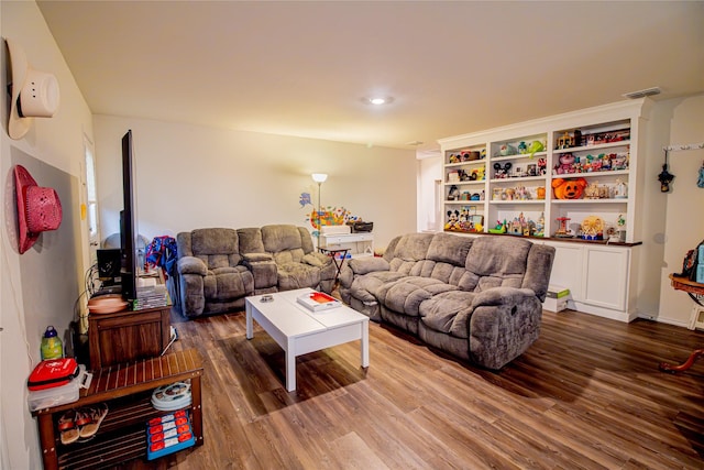 1141 Avalon Dr, Crandall, TX 75114 - living room with wood finished floors and an AC wall unit