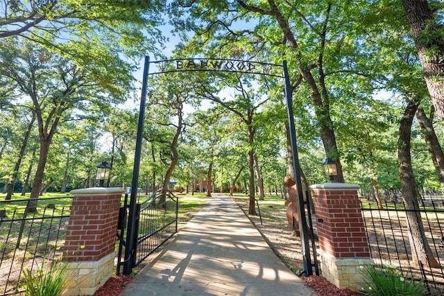 710 Eagles Landing Blvd, Oak Point, TX 75068 - gate with view of scattered trees