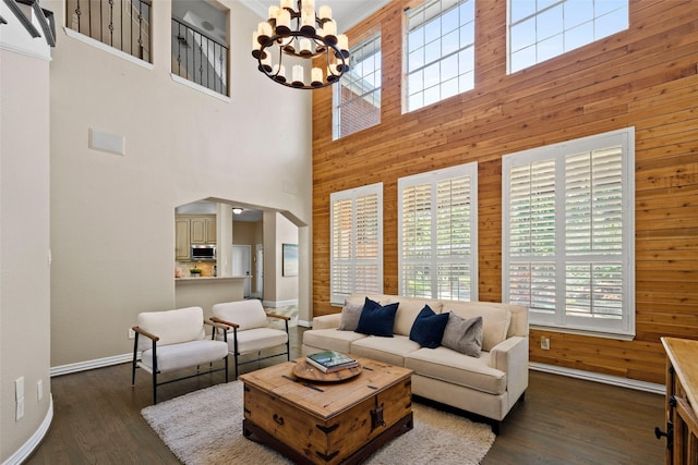 710 Eagles Landing Blvd, Oak Point, TX 75068 - living area featuring plenty of natural light, wood walls, a chandelier, baseboards, and dark wood finished floors