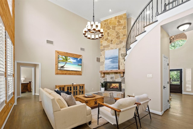 710 Eagles Landing Blvd, Oak Point, TX 75068 - living room with a towering ceiling, a stone fireplace, plenty of natural light, baseboards, and ornamental molding
