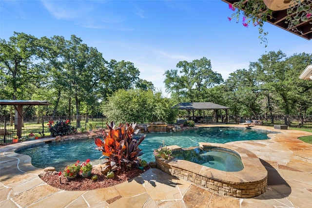 710 Eagles Landing Blvd, Oak Point, TX 75068 - view of pool with a gazebo, a patio area, a pool with connected hot tub, and view of scattered trees
