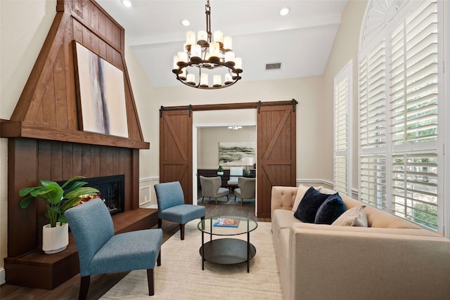 710 Eagles Landing Blvd, Oak Point, TX 75068 - living room with plenty of natural light, light wood finished floors, a barn door, a chandelier, and vaulted ceiling