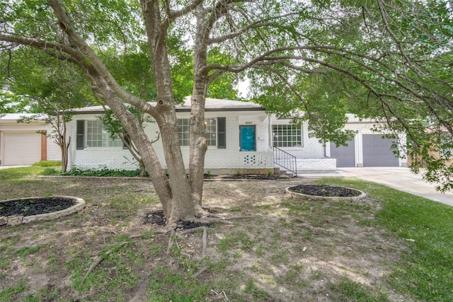 4840 Overton Ave, Fort Worth, TX 76133 - view of front of house with brick siding, a garage, and driveway