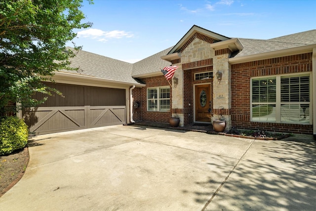 413 Sloan Creek Pkwy, Fairview, TX 75069 - view of front of property with brick siding, a garage, a shingled roof, and driveway