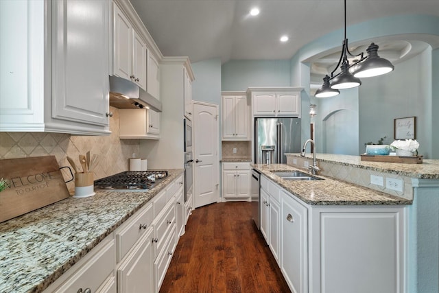 413 Sloan Creek Pkwy, Fairview, TX 75069 - kitchen with appliances with stainless steel finishes, arched walkways, a sink, under cabinet range hood, and white cabinetry