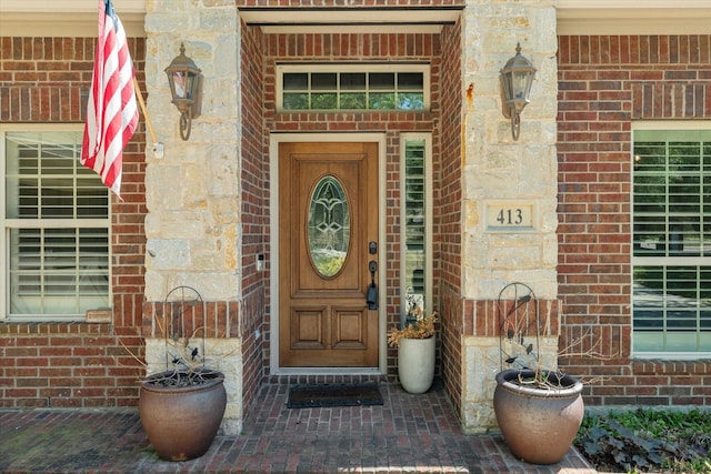 413 Sloan Creek Pkwy, Fairview, TX 75069 - view of exterior entry featuring brick siding and covered porch