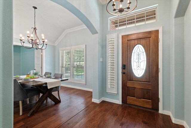 413 Sloan Creek Pkwy, Fairview, TX 75069 - foyer with a chandelier, lofted ceiling, arched walkways, baseboards, and dark wood finished floors