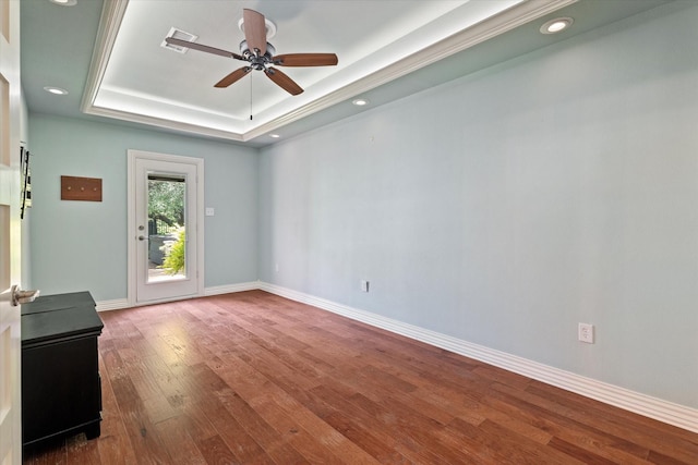 413 Sloan Creek Pkwy, Fairview, TX 75069 - unfurnished room featuring a raised ceiling, wood finished floors, a ceiling fan, baseboards, and recessed lighting