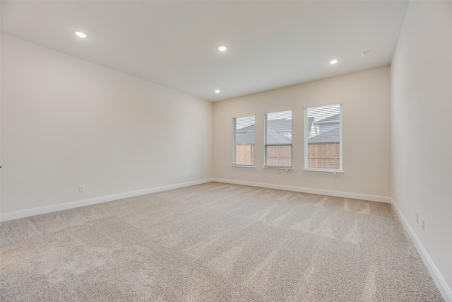 7104 Manhattan Dr, Rowlett, TX 75088 - spare room featuring light carpet, recessed lighting, and baseboards