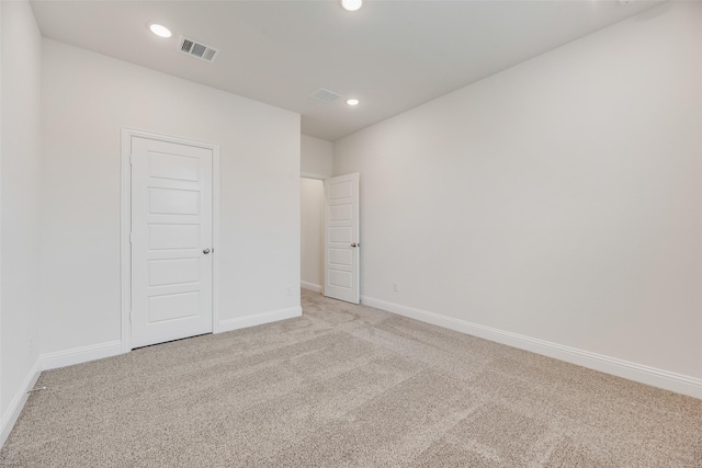 7104 Manhattan Dr, Rowlett, TX 75088 - unfurnished bedroom featuring light carpet, baseboards, and recessed lighting