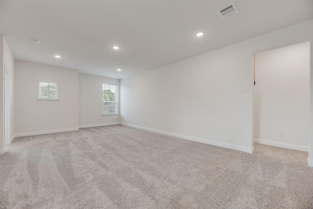 7104 Manhattan Dr, Rowlett, TX 75088 - spare room featuring light carpet, recessed lighting, and baseboards