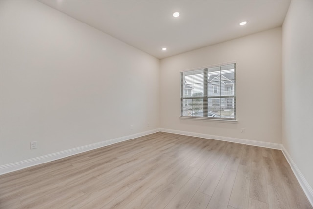 7104 Manhattan Dr, Rowlett, TX 75088 - unfurnished room featuring light wood-style floors, baseboards, and recessed lighting