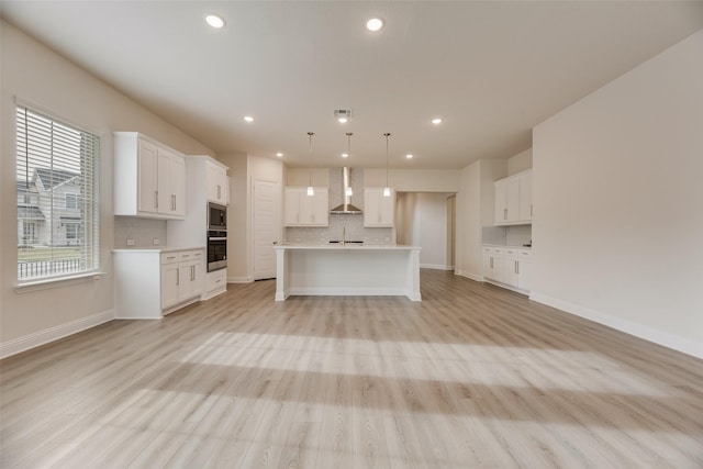 7104 Manhattan Dr, Rowlett, TX 75088 - kitchen with wall chimney exhaust hood, appliances with stainless steel finishes, backsplash, light countertops, and white cabinets