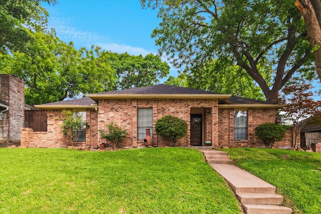 4021 Tracey Trl, Rowlett, TX 75088 - view of front of property with a front lawn, brick siding, and a shingled roof