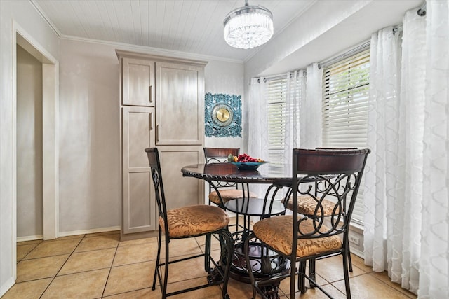 4021 Tracey Trl, Rowlett, TX 75088 - dining space with light tile patterned floors, a chandelier, crown molding, and baseboards