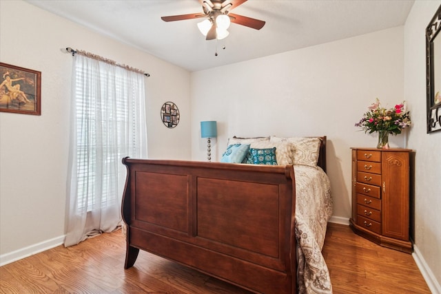 4021 Tracey Trl, Rowlett, TX 75088 - bedroom featuring wood finished floors, baseboards, and a ceiling fan