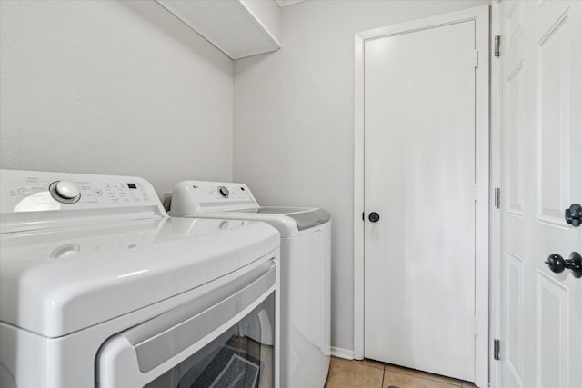 4021 Tracey Trl, Rowlett, TX 75088 - washroom with washing machine and dryer and light tile patterned floors