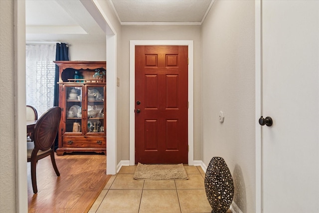 4021 Tracey Trl, Rowlett, TX 75088 - foyer with ornamental molding, baseboards, and light wood finished floors