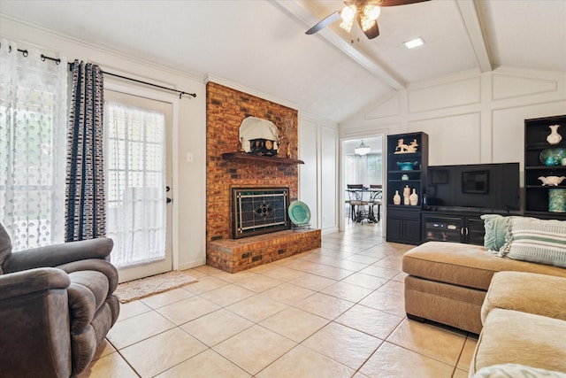 4021 Tracey Trl, Rowlett, TX 75088 - living room featuring light tile patterned floors, ceiling fan, a decorative wall, healthy amount of natural light, and a fireplace