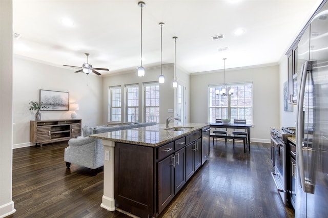 5005 Meridian Ln Unit 3102, Addison, TX 75001 - kitchen featuring appliances with stainless steel finishes, a sink, crown molding, dark wood-type flooring, and plenty of natural light