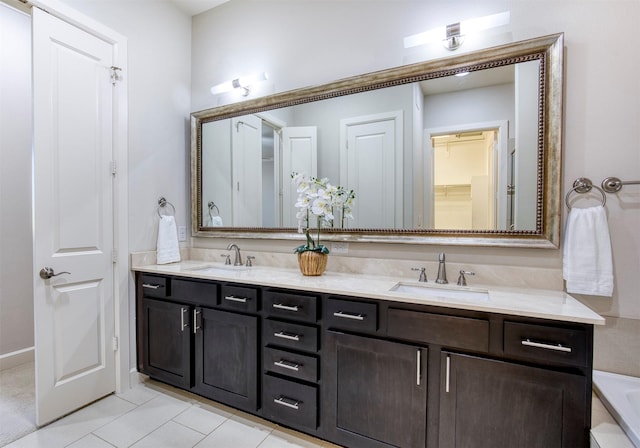 5005 Meridian Ln Unit 3102, Addison, TX 75001 - bathroom with double vanity, tile patterned floors, a tub to relax in, and a closet