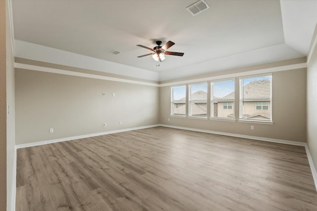 1032 Pinnacle Ridge Rd, Fort Worth, TX 76052 - spare room featuring ceiling fan, baseboards, wood finished floors, and a raised ceiling