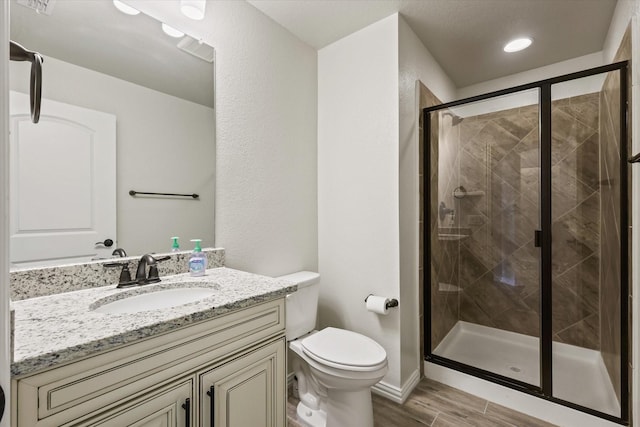 1032 Pinnacle Ridge Rd, Fort Worth, TX 76052 - bathroom featuring wood finished floors, a shower stall, toilet, and vanity
