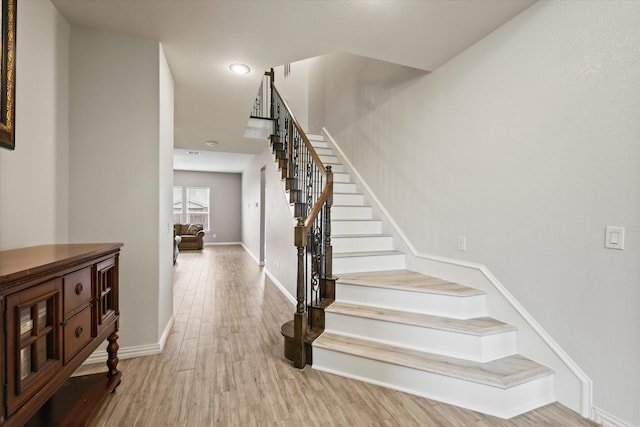 1032 Pinnacle Ridge Rd, Fort Worth, TX 76052 - staircase with wood finished floors, baseboards, and recessed lighting